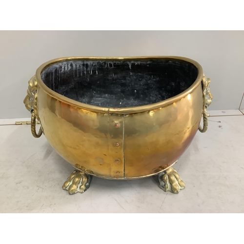 1037 - A 19th century Dutch oval and brass coal bin with lion mask ring handles, width 54cm, depth 40cm, he... 