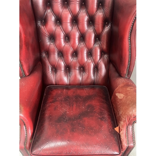 1043 - A Victorian style leather armchair, width 82cm, depth 80cm, height 110cm and footstool