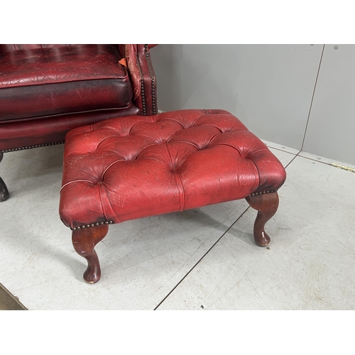 1043 - A Victorian style leather armchair, width 82cm, depth 80cm, height 110cm and footstool