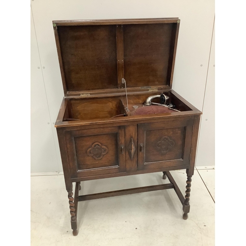 1048 - An early 20th century oak cased wind-up gramophone 'The Minstrel', width 74cm, depth 46cm, height 82... 