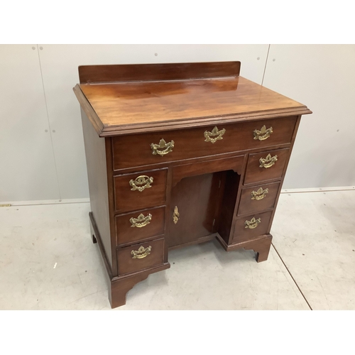 1058 - A George III and later mahogany kneehole desk with secretaire drawer, width 85cm, depth 52cm, height... 