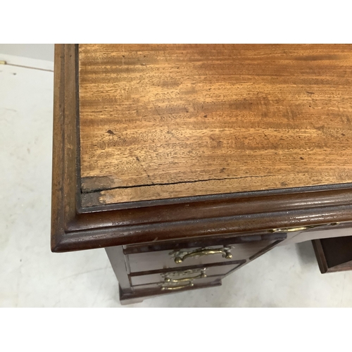 1058 - A George III and later mahogany kneehole desk with secretaire drawer, width 85cm, depth 52cm, height... 