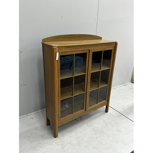 1059 - An early 20th century bleached oak glazed bookcase, width 91cm, depth 28cm, height 114cm