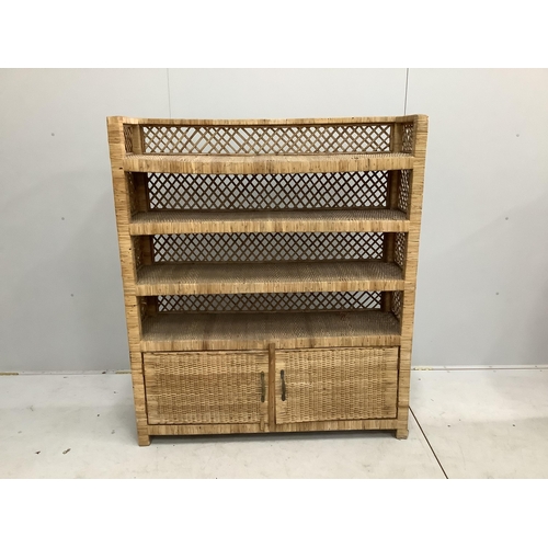 1060 - A wicker four tier shelf unit, width 121cm, depth 36cm, height 140cm, together with a wicker eight d... 