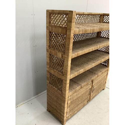 1060 - A wicker four tier shelf unit, width 121cm, depth 36cm, height 140cm, together with a wicker eight d... 