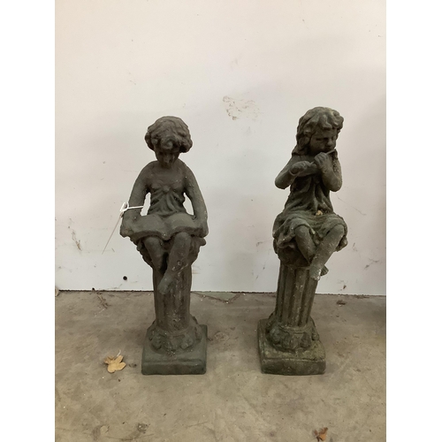 1062 - Two cast metal figural garden ornaments, larger height 40cm