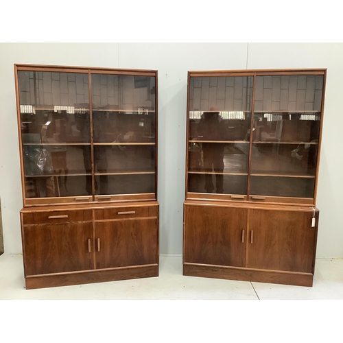 1073 - A pair of mid century Indian rosewood glazed cabinets with adjustable shelves, width 110cm, depth 38... 