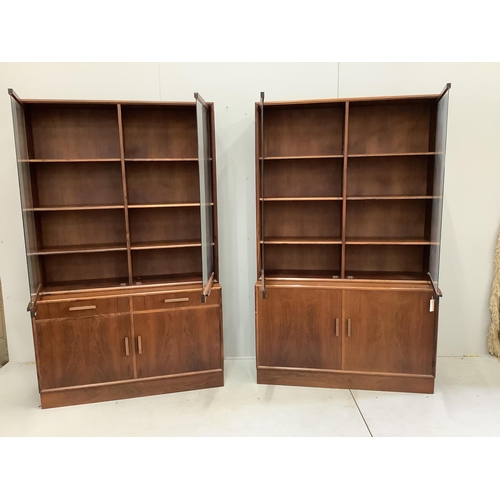 1073 - A pair of mid century Indian rosewood glazed cabinets with adjustable shelves, width 110cm, depth 38... 