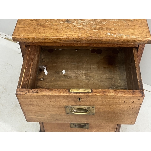 1131 - A Victorian mahogany three drawer bedside chest, adapted, width 42cm, depth 35cm, height 74cm