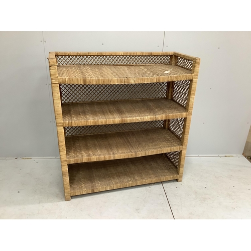 1137 - A wicker four tier shelving unit, width 121cm, depth 46cm, height 129cm