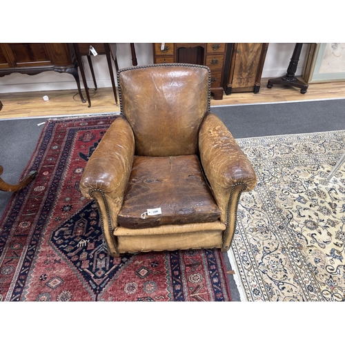 1204 - An early 20th century French studded tan leather club chair, width 64cm, depth 72cm, height 77cm... 