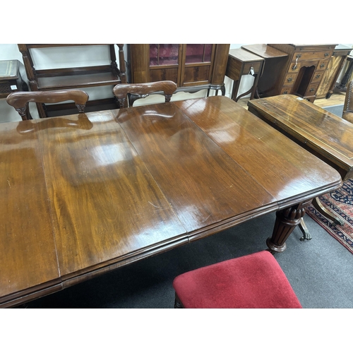 1205 - A Victorian mahogany extending dining table, 232cm extended, two spare leaves, depth 118cm, height 7... 