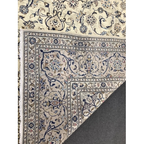 1210 - A Kashan ivory ground carpet, 284 x 195cm