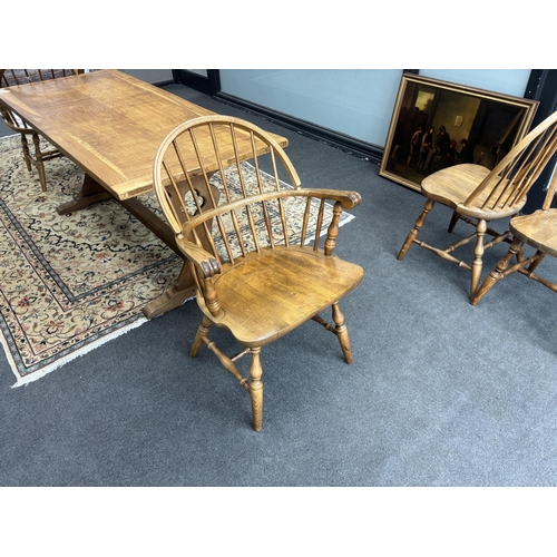 1212 - A set of six reproduction Windsor beech comb back dining chairs, two with arms