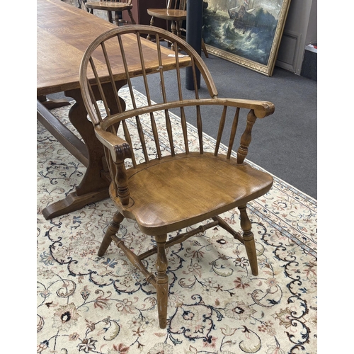 1212 - A set of six reproduction Windsor beech comb back dining chairs, two with arms