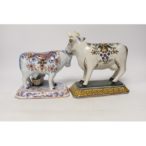 1265 - Two 19th century Delft models of cows, one with milkmaid, tallest 22cm