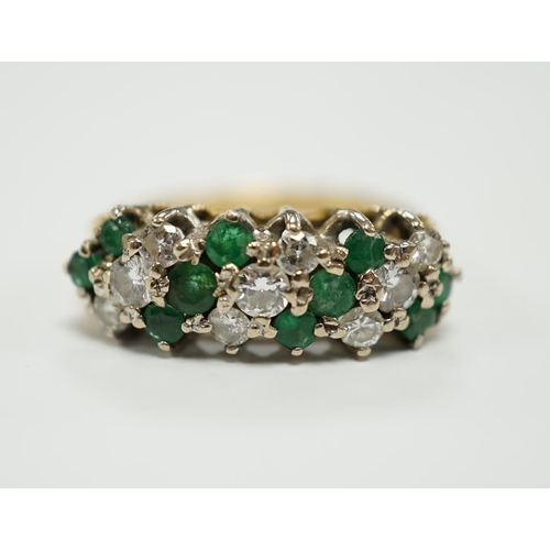 1942 - A modern 18ct, emerald and diamond set cluster half hoop ring, size O, gross weight 4.9 grams.... 