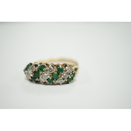 1942 - A modern 18ct, emerald and diamond set cluster half hoop ring, size O, gross weight 4.9 grams.... 