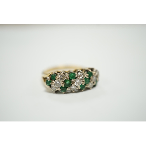 1942 - A modern 18ct, emerald and diamond set cluster half hoop ring, size O, gross weight 4.9 grams.... 