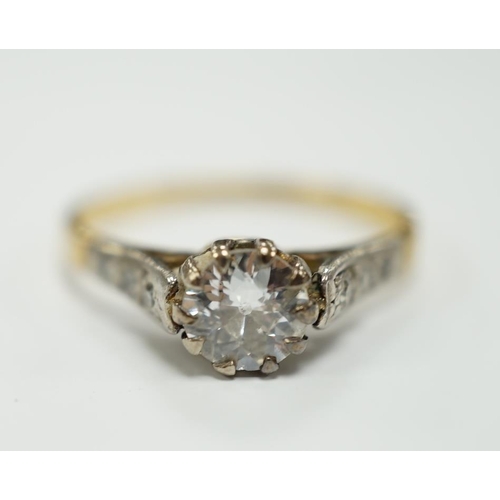 1944 - An 18ct, plat and single stone diamond set ring, with diamond chip set shoulders, the stone weighing... 