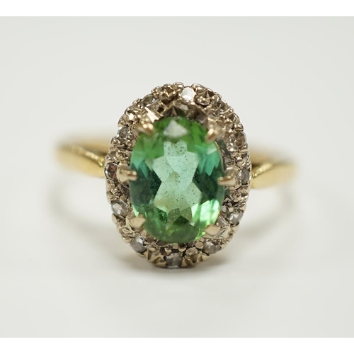 1946 - A modern 18ct gold, green tourmaline and diamond set oval cluster ring, size O/P, gross weight 3.5 g... 