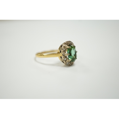 1946 - A modern 18ct gold, green tourmaline and diamond set oval cluster ring, size O/P, gross weight 3.5 g... 