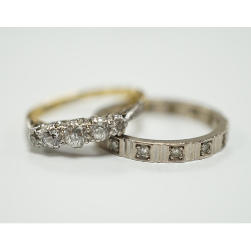 1947 - A 750 white metal and diamond chip set full eternity ring and an 18ct and graduated five stone diamo... 