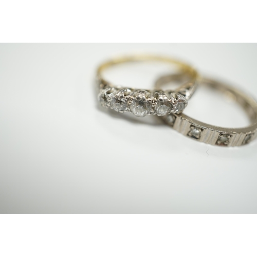 1947 - A 750 white metal and diamond chip set full eternity ring and an 18ct and graduated five stone diamo... 