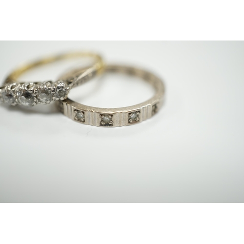 1947 - A 750 white metal and diamond chip set full eternity ring and an 18ct and graduated five stone diamo... 