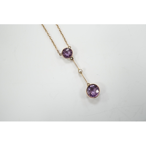 1948 - An Edwardian 9ct, two stone amethyst and single stone seed pearl set drop pendant necklace, gross we... 