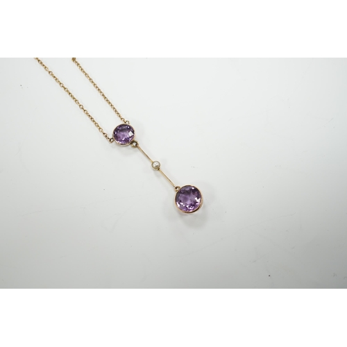 1948 - An Edwardian 9ct, two stone amethyst and single stone seed pearl set drop pendant necklace, gross we... 