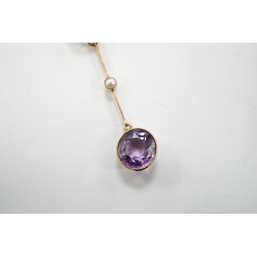 1948 - An Edwardian 9ct, two stone amethyst and single stone seed pearl set drop pendant necklace, gross we... 