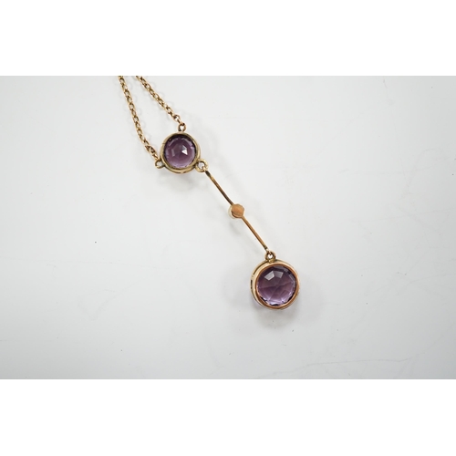 1948 - An Edwardian 9ct, two stone amethyst and single stone seed pearl set drop pendant necklace, gross we... 