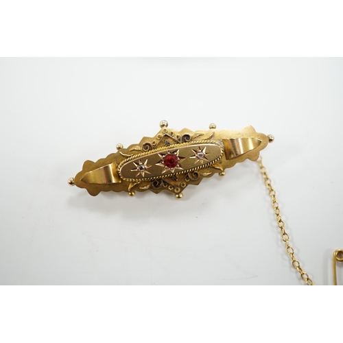 1950 - An Edwardian 9ct gold ruby and diamond chip set hinged bangle and a similar yellow metal, ruby and d... 