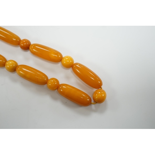 1951 - A single strand amber bead necklace, 50cm, gross weight 32 grams.