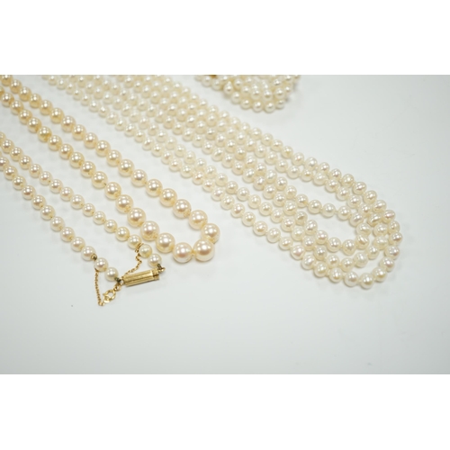 1956 - Two Cultured pearl necklaces including a triple strand with yellow metal and sapphire set clasp, 46c... 