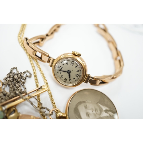 1961 - A lady's yellow metal manual wind wrist watch, on a 9ct expanding bracelet, a modern 9ct gold and wh... 