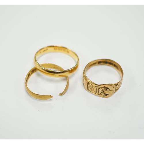 1964 - Two 22ct gold wedding bands (one cut), 5.8 grams and an 18ct gold buckle ring, 2.9 grams.