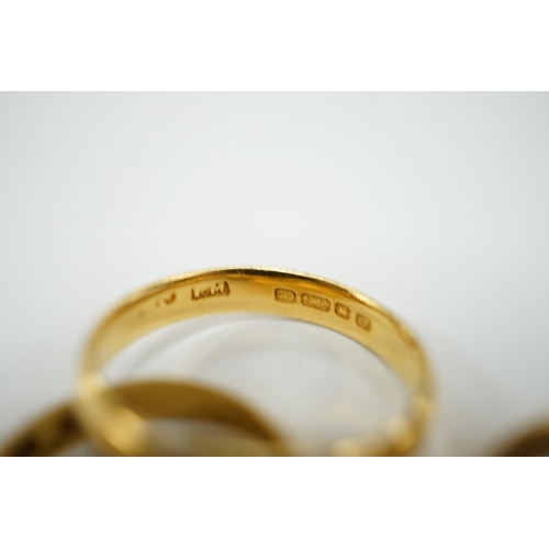 1964 - Two 22ct gold wedding bands (one cut), 5.8 grams and an 18ct gold buckle ring, 2.9 grams.