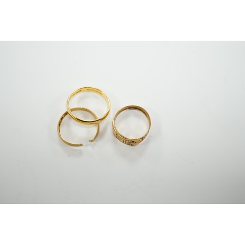 1964 - Two 22ct gold wedding bands (one cut), 5.8 grams and an 18ct gold buckle ring, 2.9 grams.