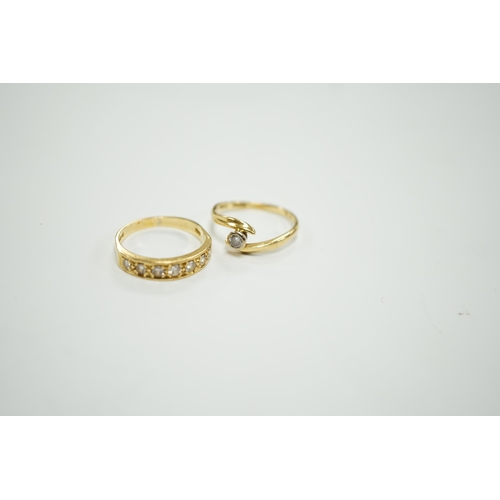 1966 - A modern 18ct gold and graduated seven stone diamond set half hoop ring, size O and a similar solita... 