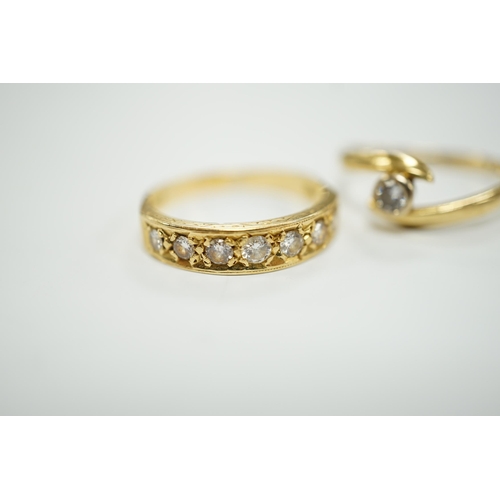 1966 - A modern 18ct gold and graduated seven stone diamond set half hoop ring, size O and a similar solita... 