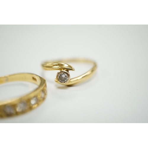 1966 - A modern 18ct gold and graduated seven stone diamond set half hoop ring, size O and a similar solita... 