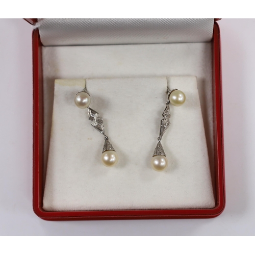 1977 - A pair of white metal, two stone cultured pearl and two stone diamond chip set drop earrings, 37mm, ... 