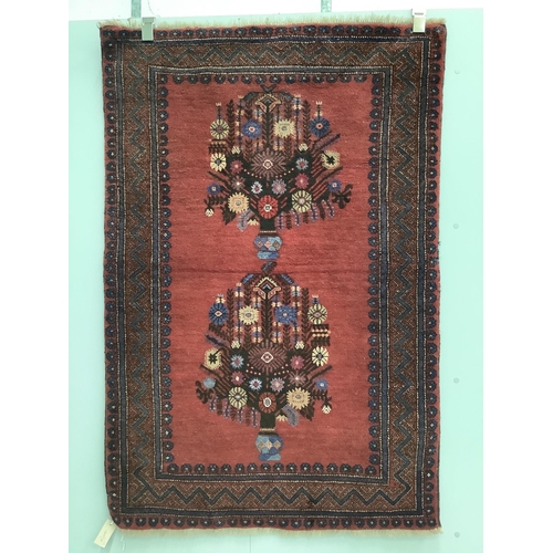 141 - Two Persian red ground rugs, larger 148 x 102cm