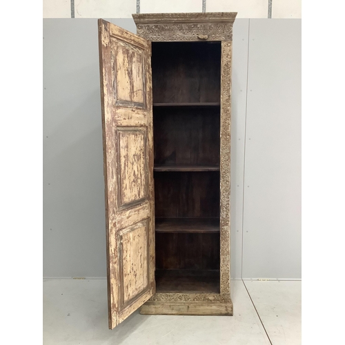 164 - An Indian carved hardwood tall side cabinet, width 72cm, depth 48cm, height 218cm