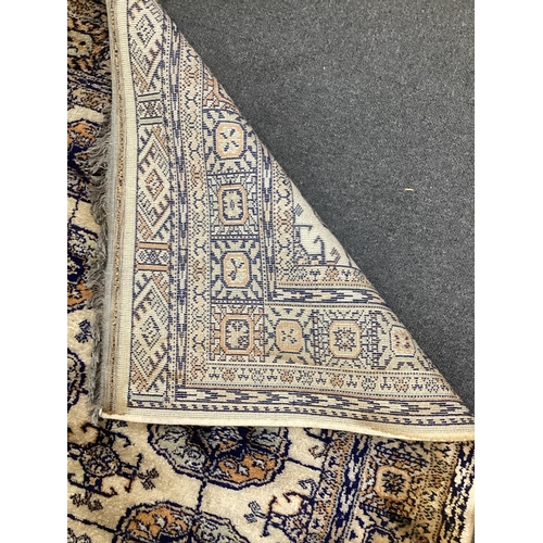 175 - A Bokhara rug and a small Chinese rug, larger 180 x 132cm