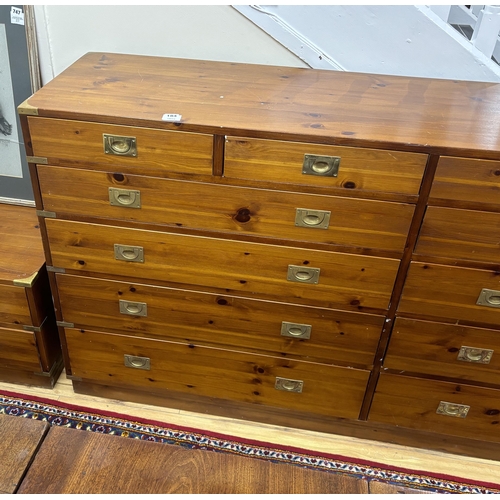 184 - A large military style brass mounted pine twelve drawer chest, width 183cm, depth 46cm, height 97cm... 