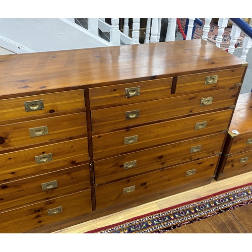 184 - A large military style brass mounted pine twelve drawer chest, width 183cm, depth 46cm, height 97cm... 