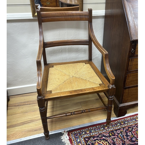 187 - A pair of late Victorian Arts & Crafts mahogany rush seat elbow chairs, width 53cm, depth 49cm, heig... 